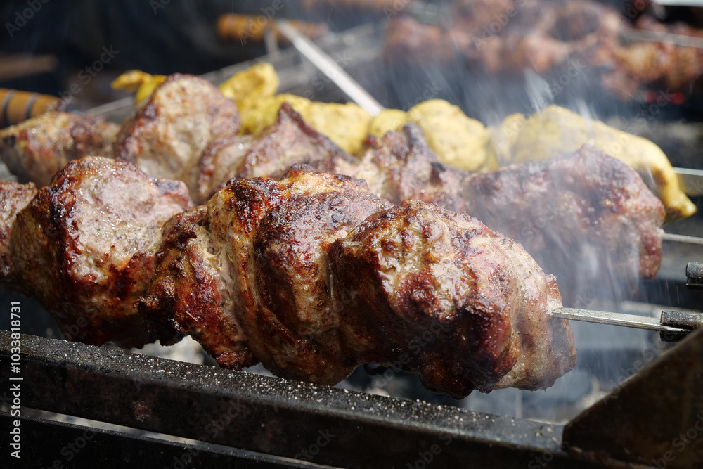 Shish kebabs broils in barbecue. Delicious hot kebabs. Meat are cooked Shish kebabs broils in barbecue. Delicious hot kebabs. Meat are cooked