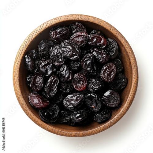 Top view of a wooden bowl filled with dried cherries isolated on white background