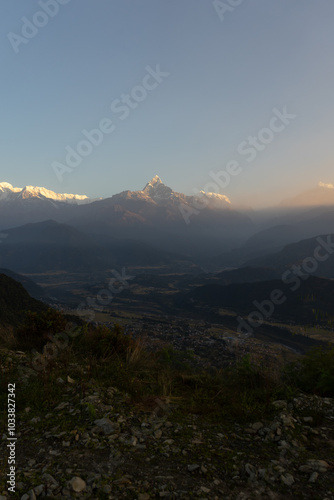 Misty morning view of a majestic mountain range.