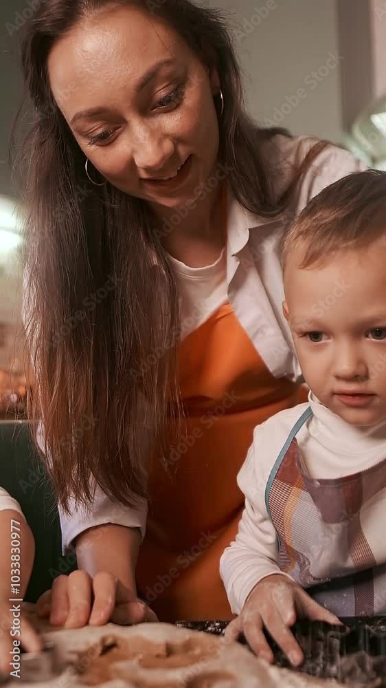 Family day, mom and kids baking in the kitchen. Christmas traditions highlighting the importance of creating family rituals. Family day, mom and kids baking in the kitchen. Christmas traditions highlighting the importance of creating family rituals.