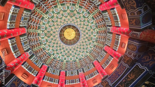 Tablou pe pânză A mesmerizing view of a colorful, intricately patterned dome ceiling with geometric symmetry, showcasing stunning architectural details and vibrant design elements