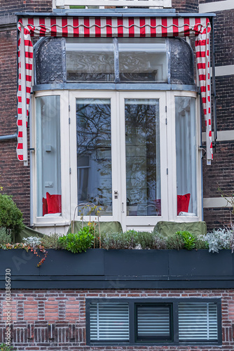 Villa (1884), consisting of three residential buildings in the Flemish Renaissance style with two corner towers and bay windows on Weteringschans 10 - 14. Amsterdam, The Netherland.  photo