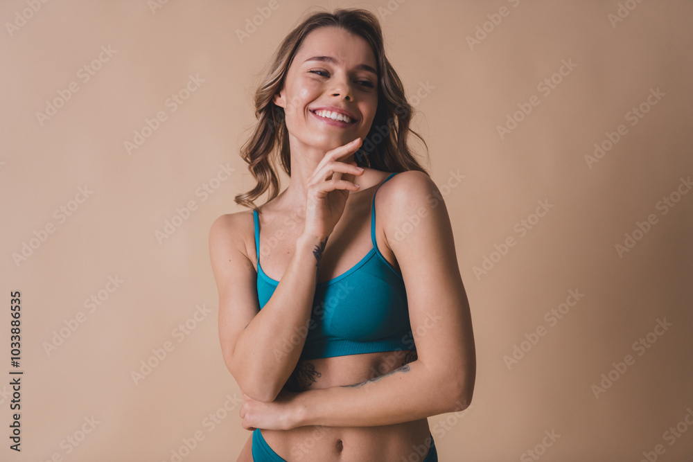 Photo of young lady touch soft skin face dressed cyan lingerie beige background no filter self acceptance Photo of young lady touch soft skin face dressed cyan lingerie beige background no filter self acceptance