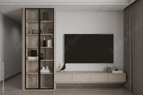 The living room has a minimalist interior with a wall display glass door cabinet beside the TV.