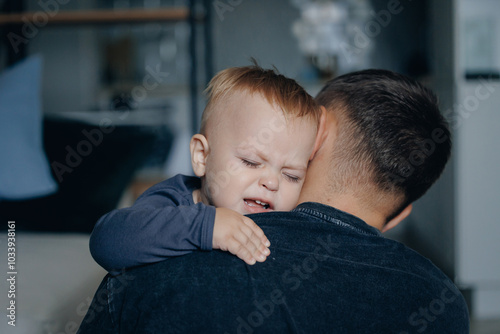 Фотография Fatherhood concept, child son hugs father closeup and cries
