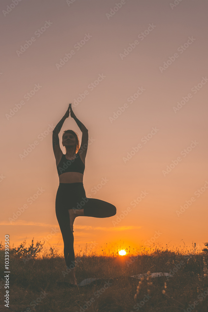 Silhouette of Woman Doing Yoga at Sunset on Nature