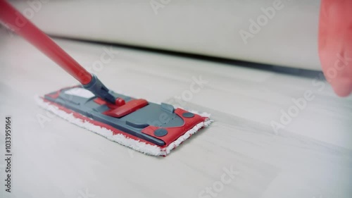 Home cleaning with modern red floor mop