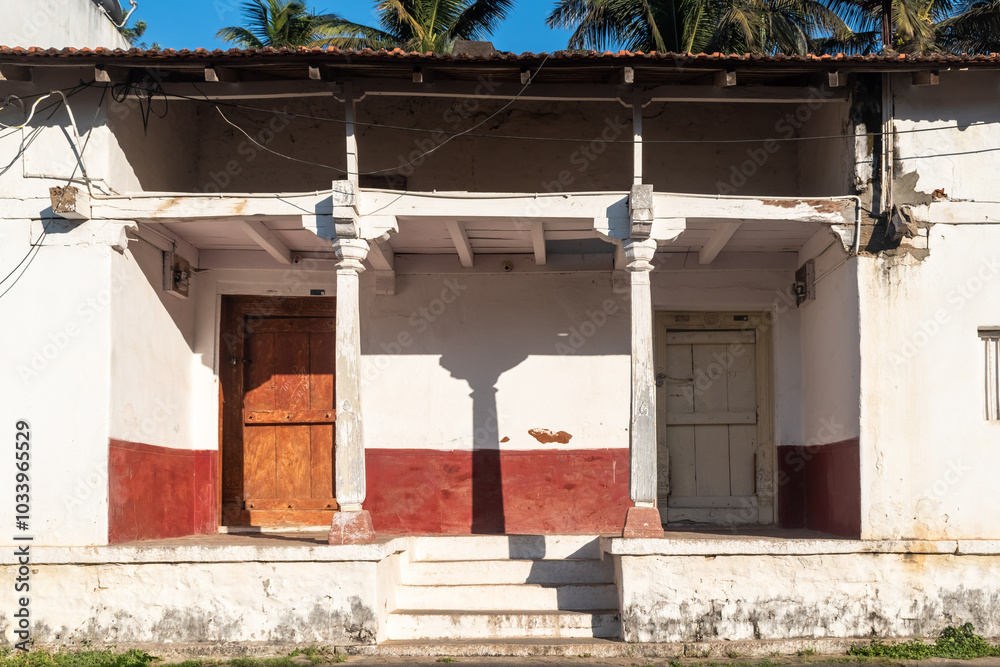 An old rustic house with white walls in the village An old rustic house with white walls in the village