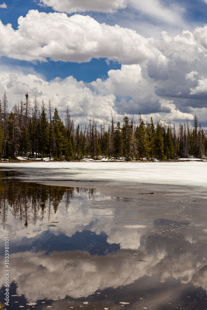 Fototapeta premium Scenic Mountain Lake Reflection With Dramatic Clouds