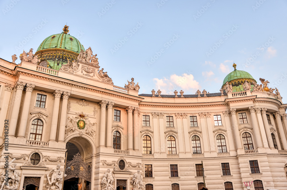 Fototapeta premium Vienna, Austria - July 23, 2024: Exteriors of the Hofburg Palace in the early morning in Vienna 