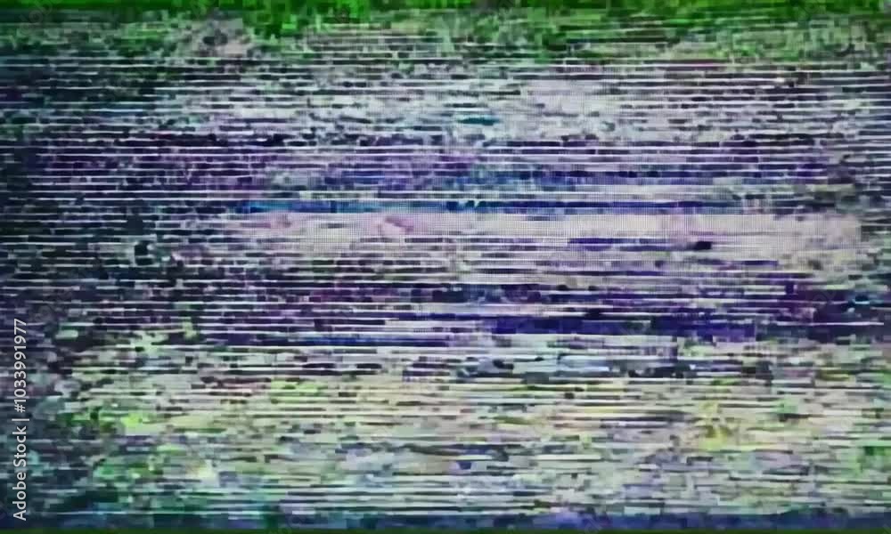 A distorted image displaying static interference with a greenish hue, resembling a malfunctioning screen. A distorted image displaying static interference with a greenish hue, resembling a malfunctioning screen.