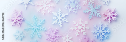 Paper cut snowflakes on pastel solid background. Winter holiday background