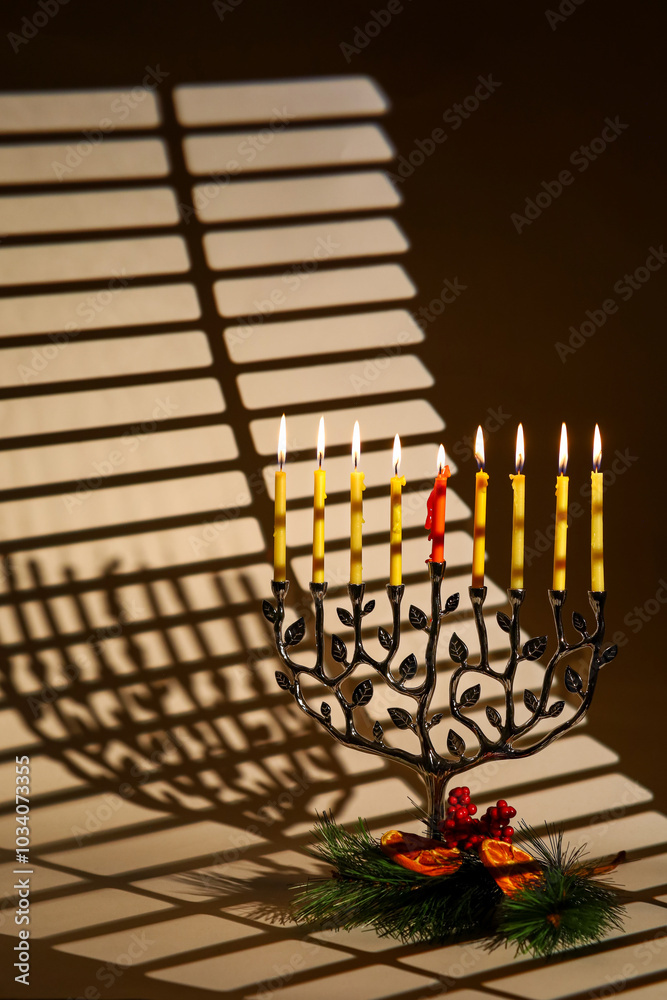 Evening Menorah with Lit Candles and Christmas Pine Branch Decor. A blend of Hanukkah and Christmas spirit. Chrismukkah Celebration Evening Menorah with Lit Candles and Christmas Pine Branch Decor. A blend of Hanukkah and Christmas spirit. Chrismukkah Celebration