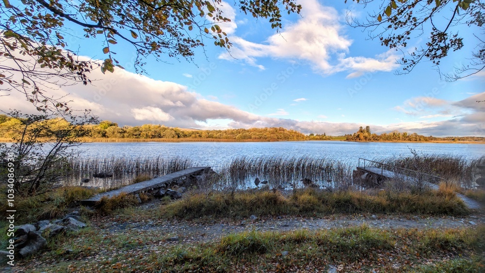 Beautiful lakeside landscape scenery, mountains reflected in Ross lake, county Galway, Ireland, nature background