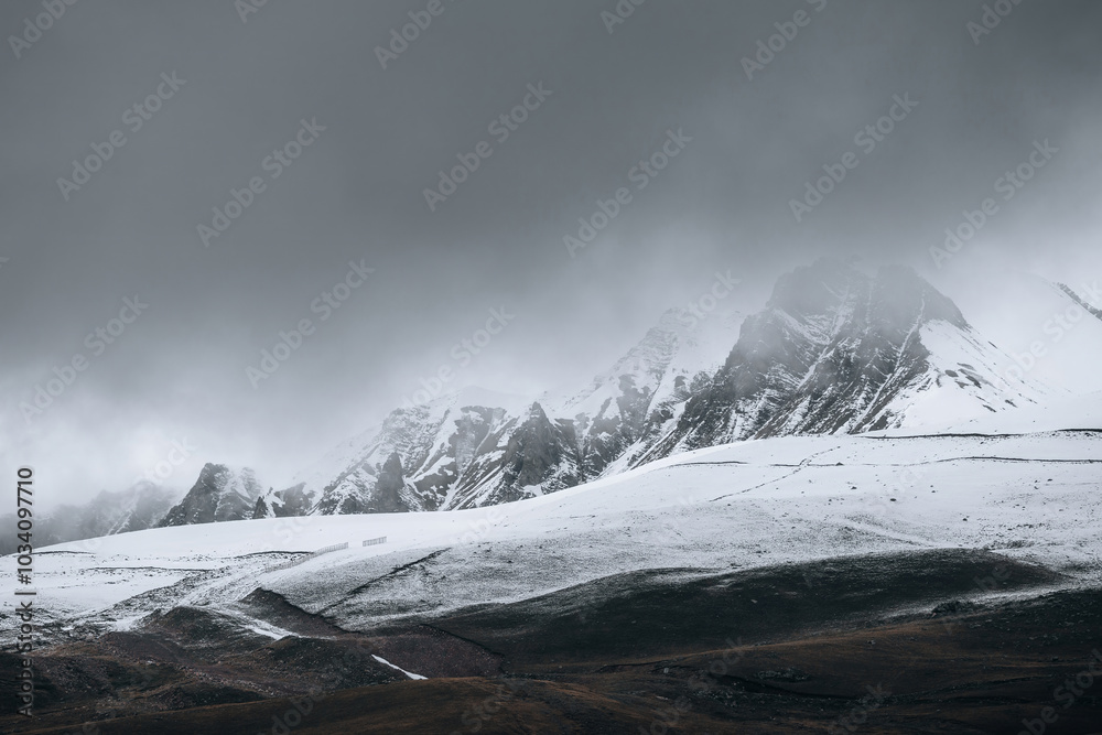 Obraz premium Snow-capped mountains with clouds, Caucasus mountains,