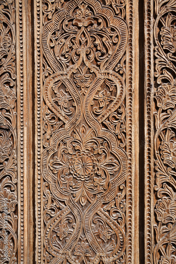 Old wooden carved door. Khiva. Uzbekistan Old wooden carved door. Khiva. Uzbekistan