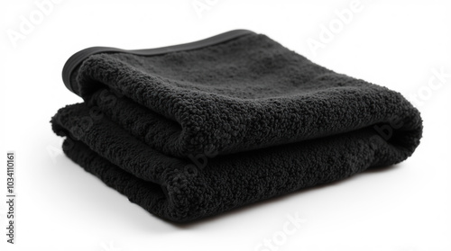 Black towel folded neatly on white isolated background