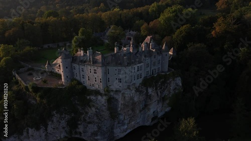 Discover the enchanting beauty of Walzin Castle at sunset in Belgium photo