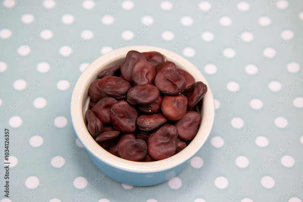 A bowl of Red Epicure Broad Bean on a kitchen table ready to be cooked in a dish A bowl of Red Epicure Broad Bean on a kitchen table ready to be cooked in a dish