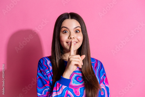 Photo portrait of pretty teen girl shh keep secret wear trendy colorful outfit isolated on pink color background photo