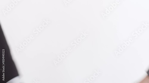 two people shaking hands on a white background