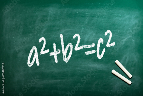Pythagorean theorem a2+b2=c2 the famous formula to calculate the hypotenuse of a triangle written on an old fashioned blackboard 