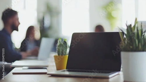 Modern Workspace with Laptop and Green Plants A Creative Environment for Collaboration and Productivity in the Office