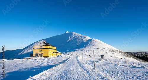 winter landscape under Sniezka summit during sunny day in Karkonosze mountains in Poland