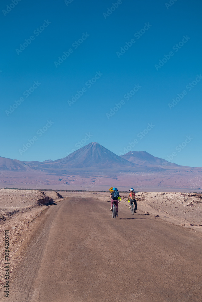 person riding a bike in the desert person riding a bike in the desert