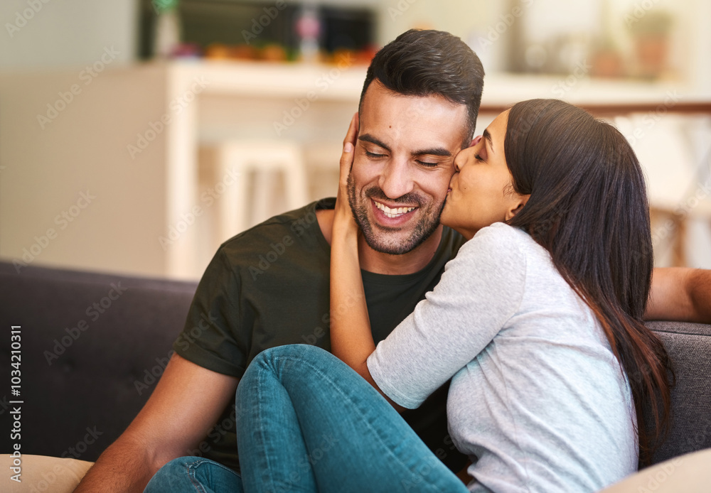 Smile, couple and kiss on couch at house with love, bonding together and healthy relationship for security. Happy, people and affection with calm morning, romance and partner gratitude for commitment