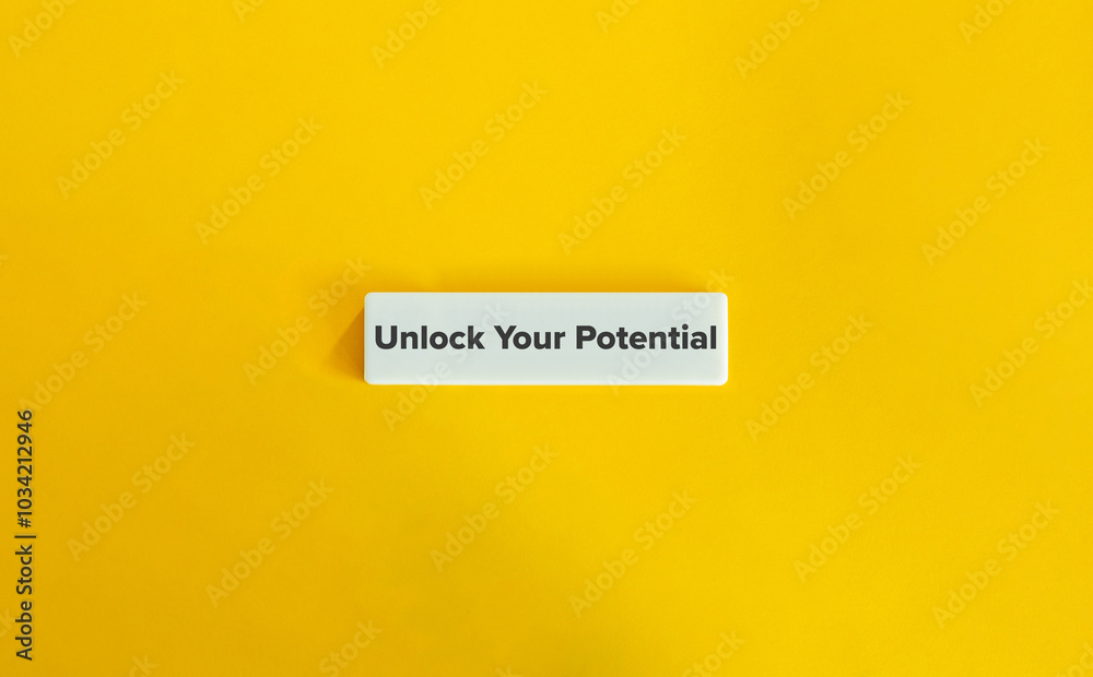Unlock Your Potential Banner. Text on Block Letter Tile on Yellow Background. Minimal Aesthetic. Unlock Your Potential Banner. Text on Block Letter Tile on Yellow Background. Minimal Aesthetic.
