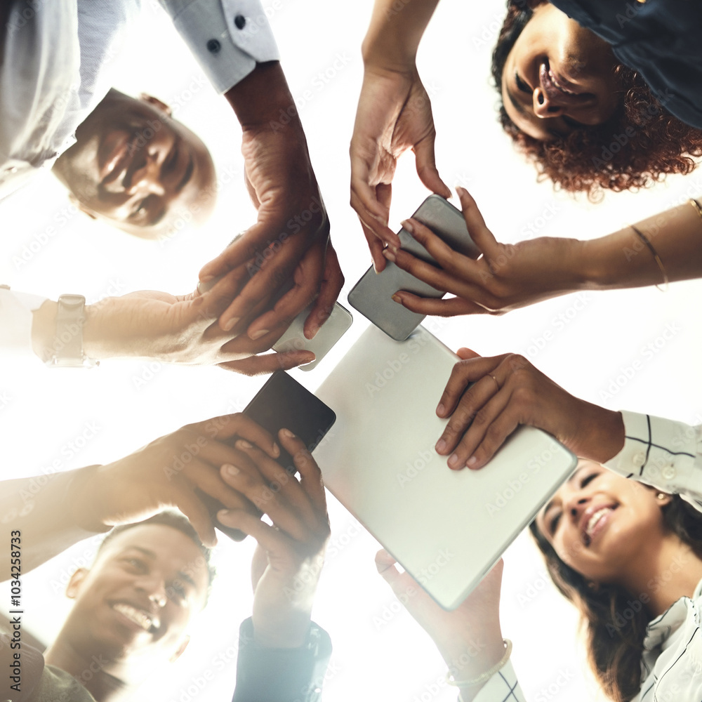 Obraz premium Employees, hands and tech for meeting in huddle, campaign project and research media trend. Staff, low angle and office for feedback on audience engagement, online and connect for news in circle