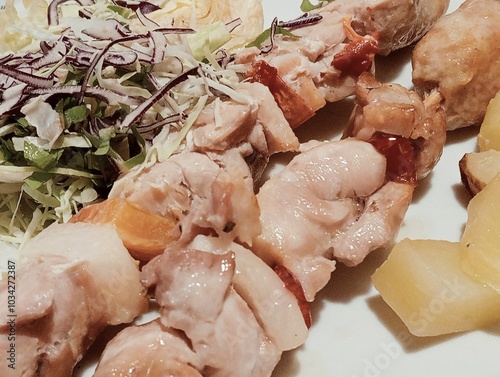 Obraz na płótnie Italian dish with meat skewers, salad and baked potatoes w salonie