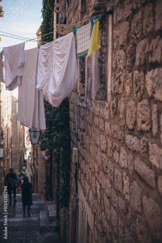 clothes sun drying, hanging on line above the narrow street in Old Town, Dubrovnik, Croatia