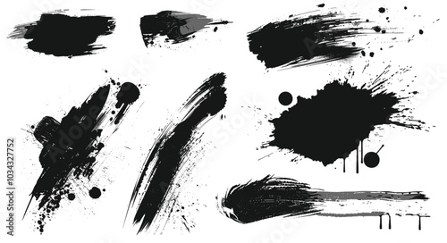 A collection of abstract black paintbrush strokes and splatters on a white background, showcasing dynamic artistic elements and creative expression.