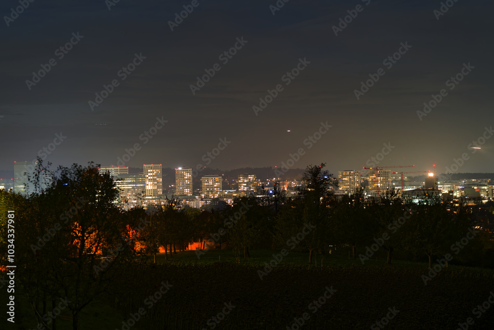 Skyline with skyscrapers and city lights at Swiss City of Zürich on a dark autumn night. Photo taken October 17th, 2024, Zurich, Switzerland. Skyline with skyscrapers and city lights at Swiss City of Zürich on a dark autumn night. Photo taken October 17th, 2024, Zurich, Switzerland.