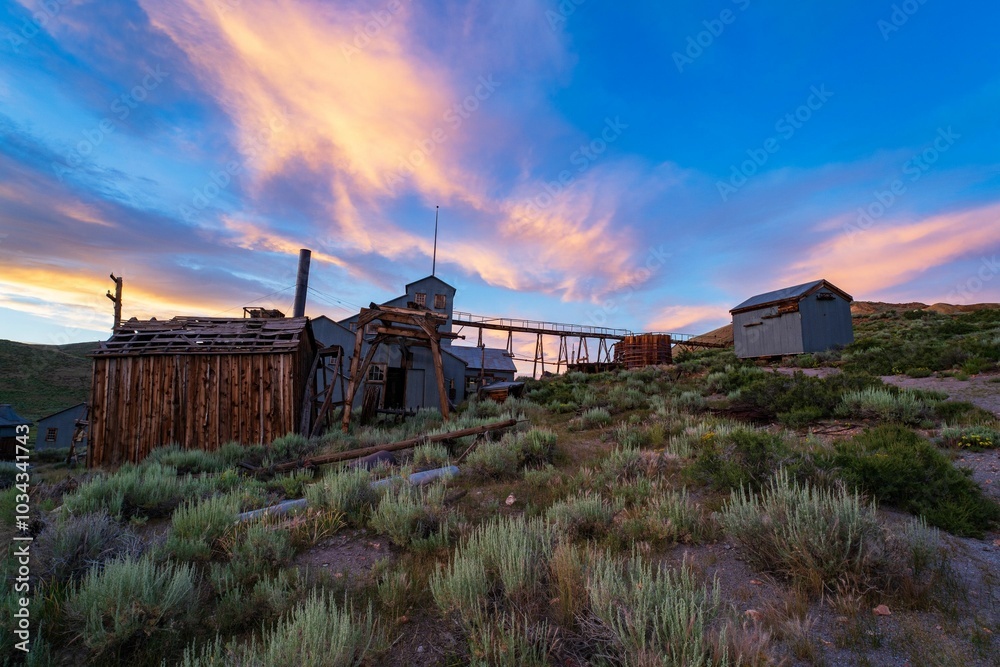 Beautiful sunset over an abandoned wooden mining structure in Bodie State Historic Park, California Beautiful sunset over an abandoned wooden mining structure in Bodie State Historic Park, California