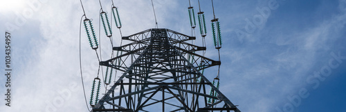 electric pylon blue sky in background photo