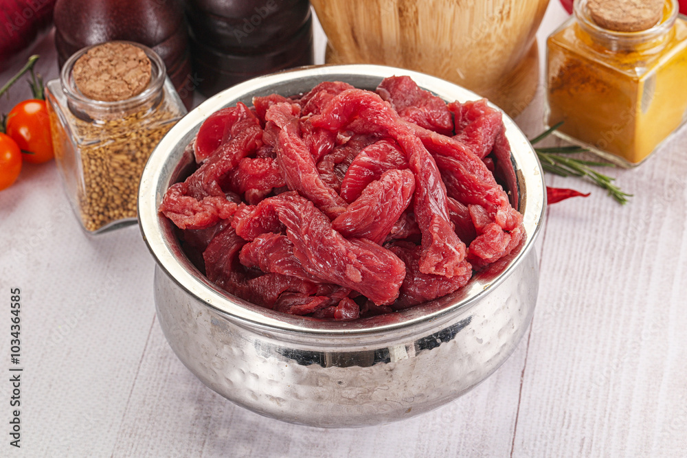 Raw beef meat - sliced strips Raw beef meat - sliced strips