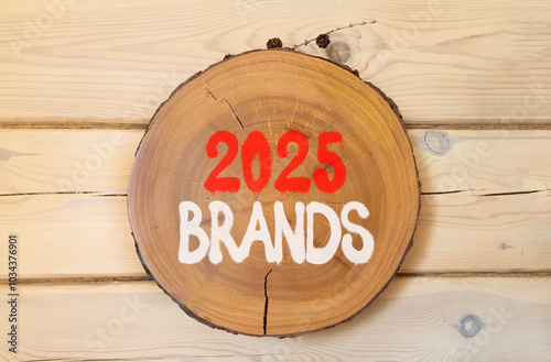 Planning 2025 brands new year symbol. Concept words 2025 Brands on beautiful wooden circle. Beautiful wooden wall background. Business 2025 brands new year concept. Copy space.