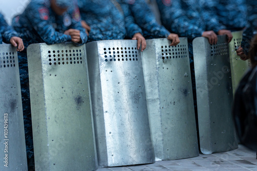 Принти на полотні Police with shields during a protest in the city, political unrest