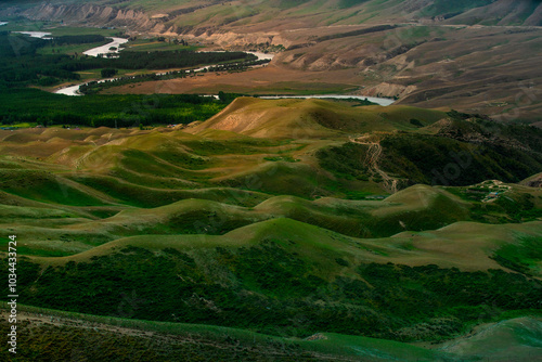 Nine Curves Eighteen Bends, one of the scenic areas in Kalajun Grassland, formed by Kuokesu River twists and turns at the bottom of Kuokesu Grand Canyon like a dragon, Tekes County, Xinjiang, China photo