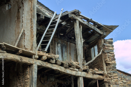 Ruined house made of stone and wood