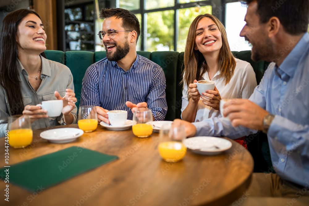 Group of friends chilling at the cafe. Talking, drinking coffee and orange juice. Group of friends chilling at the cafe. Talking, drinking coffee and orange juice.