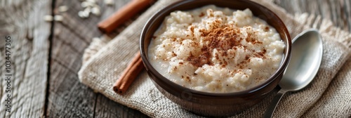 A sful of creamy buckwheat porridge topped with a sprinkle of cinnamon making for a hearty and nutritious breakfast option. photo