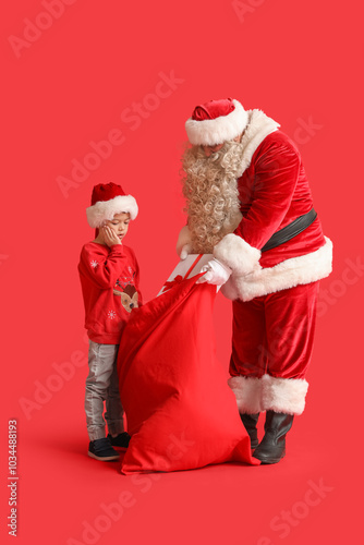 Santa Claus and cute little...