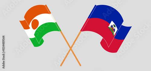 Crossed and waving flags of Niger and Republic of Haiti. Vector illustration