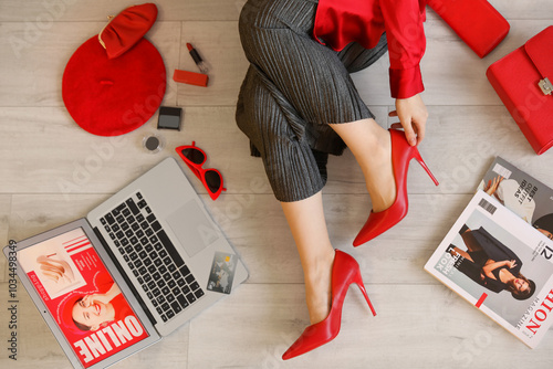 Stylish woman with laptop a...