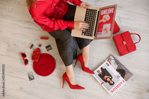 Stylish woman with laptop a...