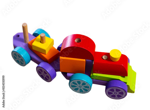 Colorful wooden toy stacking train with wagons made from blocks of different shapes and sizes placed . Concept of toys for fun and constructive play of toddlers. Isolated over white background